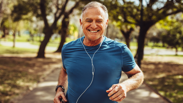 an elderly man exercising while running