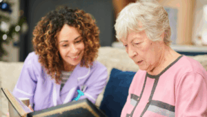 a nurse reading with a senior lady